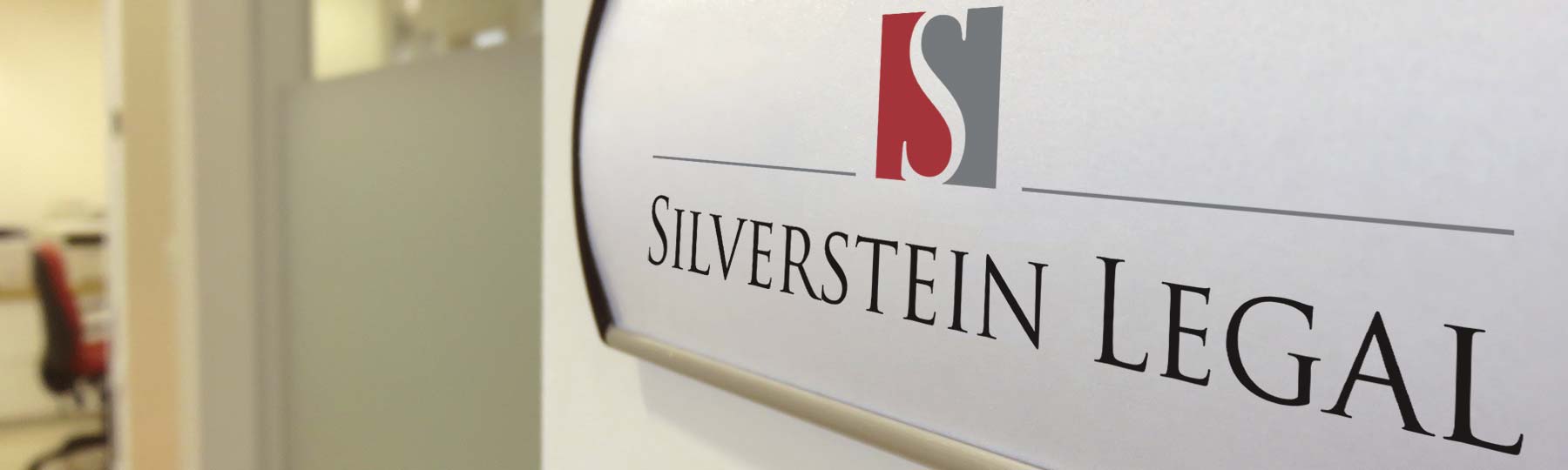 Name plate on wall showing Silverstein Legal logo