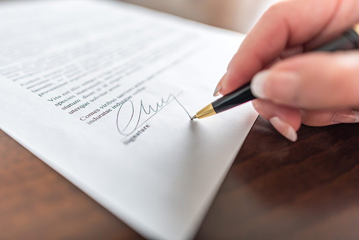 Person signing contract