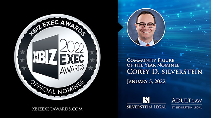 XBIZ 2022 Exec Nominee logo with headshot of Corey Silverstein and white serif type to right on sparkly blue background