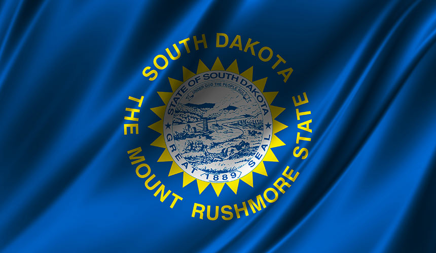 Photo of South Dakota state flag in blue and yellow