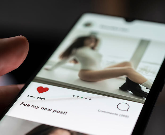 Photo of a man watching porn on his phone