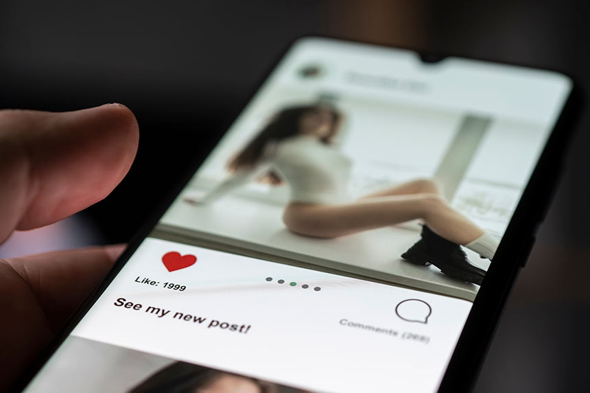 Photo of a man watching porn on his phone