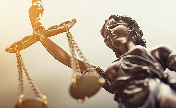 Photo of lady justice holding scales