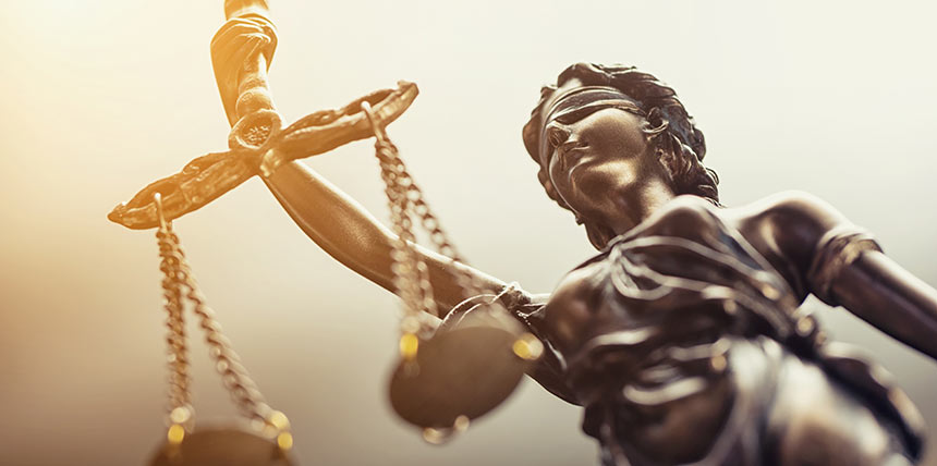 Photo of lady justice holding scales