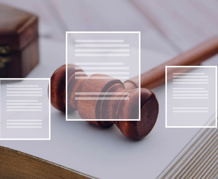 Photo of a gavel on an open book with overlaying illustrated document icons