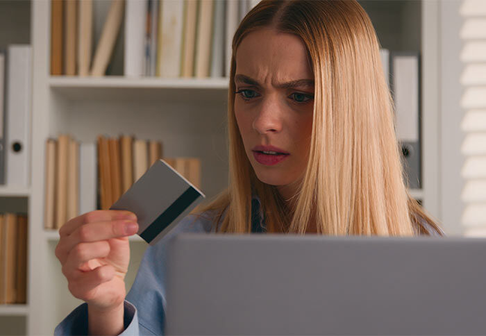 Photo of a woman trying to use a credit card