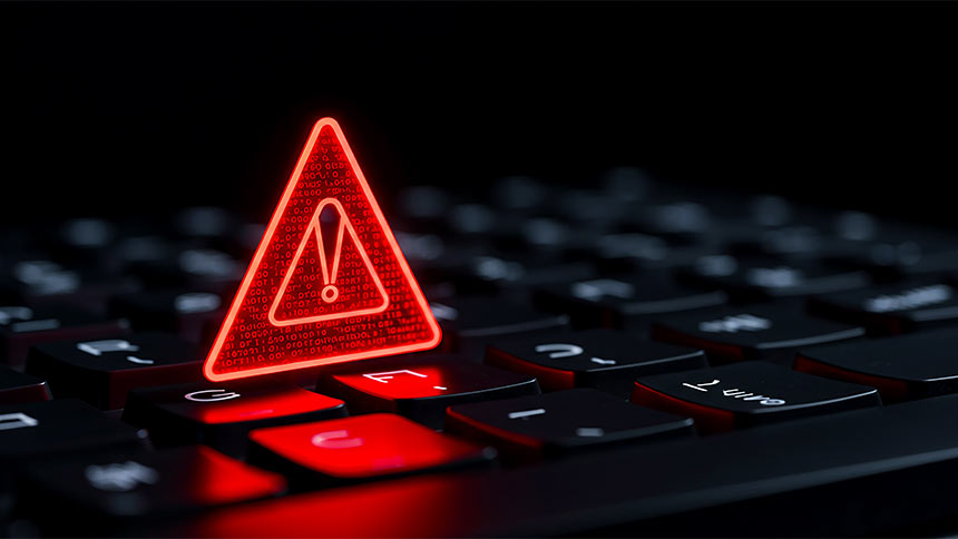 Photo of keyboard with digital warning icon in red