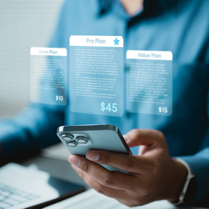 Photo of a person using their phone to choose a subscription
