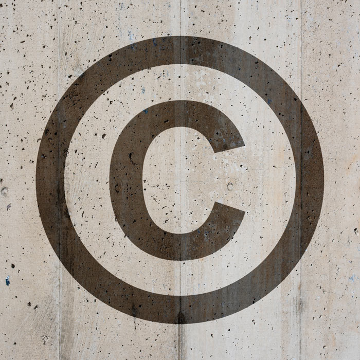 Photo of a Copyright symbol on distressed background
