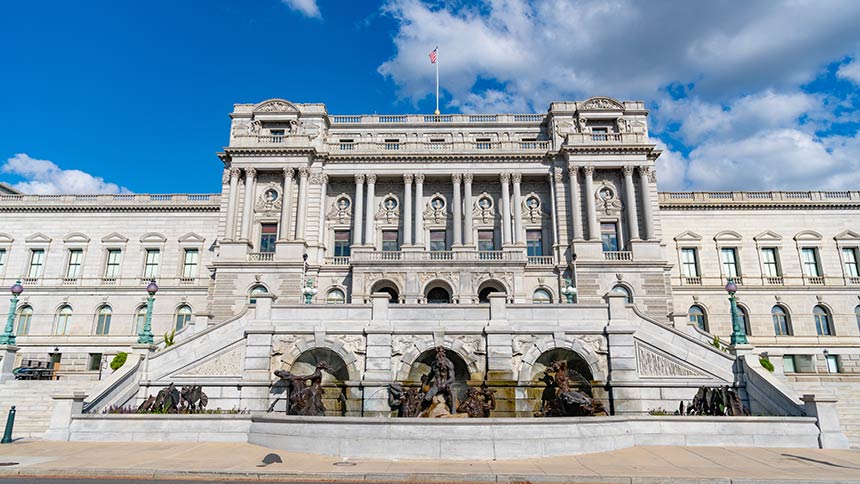 Photo of Congress building in Washington DC under blue sky.